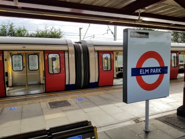 An Underground train at Elm Park station.